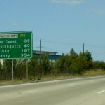 Picture of roadside sign with distances to Gold Coast and Sydney